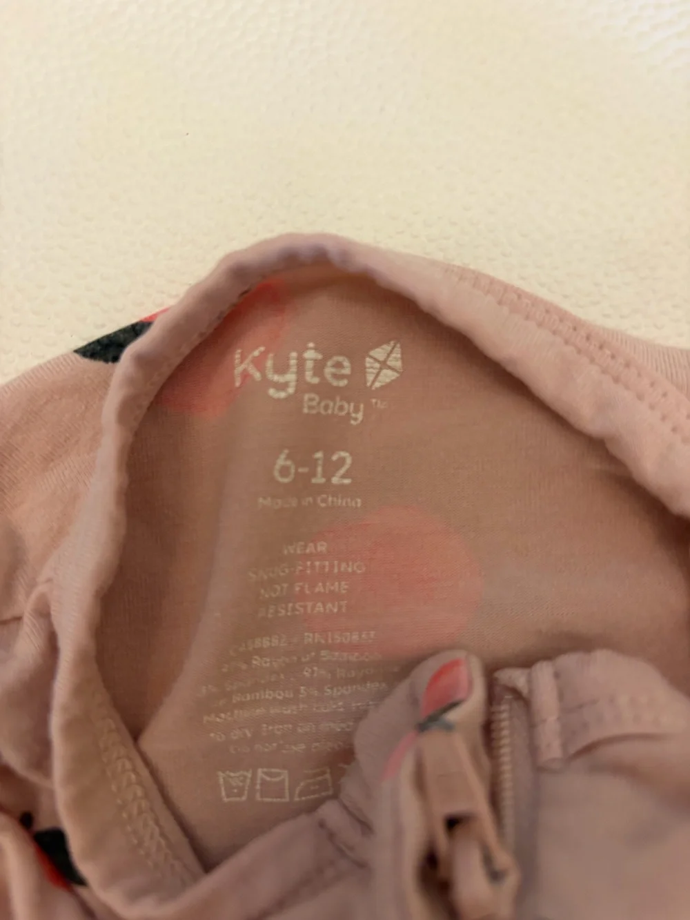 Kyte Baby Footie Zipper Pajamas TRIO. Purple, Peach Print, Yellow. 6-12mo